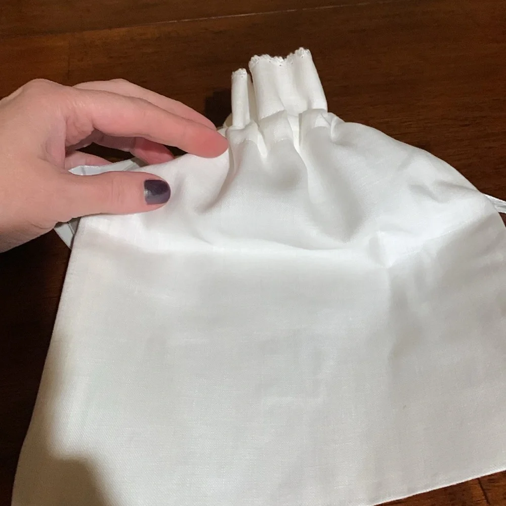 And beautiful hand made rare linen pouch with letter N hand dawn. Brand new!